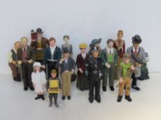 A quantity of ceramic dolls house figurines.