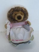 A Beatrix Potter soft toy being Mrs Tiggiwinkle measuring approx 25cm high.
