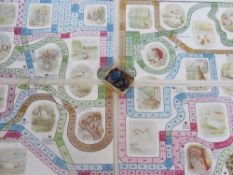 A Peter Rabbit board game with four lead figures.