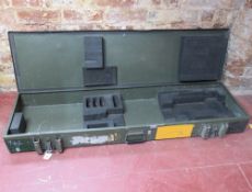 A green painted metal transit case.