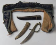 A knife with scabbard, together with another scabbard and a chain coat collar.