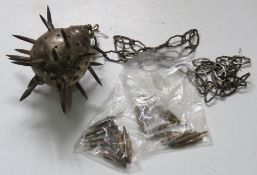A mace on chain, some spikes separated.
