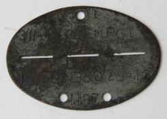 A SS Panzer Grenadier dog tag.