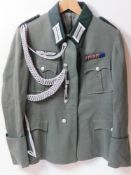 A WWII German Officers Administrative 4 pocket tunic, with the officer aiguillette,
