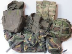A quantity of assorted webbing inc helmet with camouflage cover.