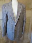 A 100% wool mens suit jacket 40in chest.