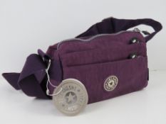 An 'as new' fabric handbag in purple mea