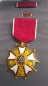 A WWII US Legion of Merit medal with cas