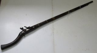 An antique Flintlock rifle.