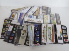 A large quantity of presentation pack stamps, over 100.