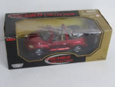 A Motor Max 1/18 scale model Chrysler PT Cruiser.