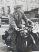A photo of Stan Rodwell (of Stanley Phelps motorbike and parts shippers) on an AJS motorbike,