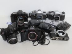 A quantity of assorted camers including Canon, Praktika, Pentax, Minolta, etc.