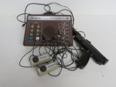 A Binatone colour tv game MK6 with controllers and 'gun' Disclaimer - all items in this sale are