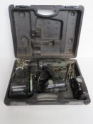 A Hitachi drill with various drills and screws.