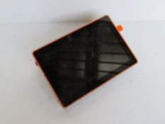 A tablet style computer with clear perspex case.