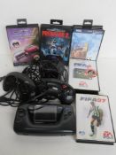 A Sega portable video game console together with Sega games cartridges, Sega controllers etc.