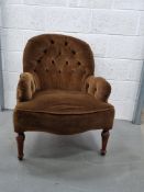 A fine green upholstered spoon back fireside chair.