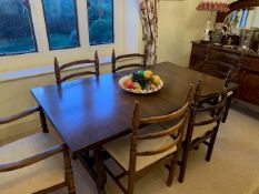 A 'Younger Toledo' Spanish style extending dining table with built in folding leaf,