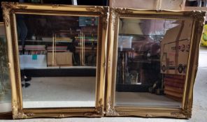 A pair of fine bevel edged mirrors in gilt painted frames, each measuring approx 59 x 49cm overall.
