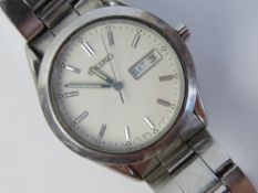 A stainless steel Seiko wrist watch having white dial with day and date apertures,