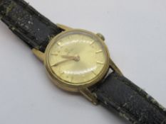 A 9ct gold ladies Omega cocktail watch, gold coloured dial, hallmarked 375 to case, on worn strap.