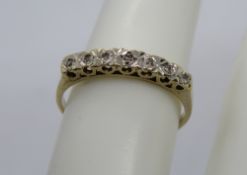 A 9ct gold and diamond half eternity ring, hallmarked 375, size M-N, 1.7g.