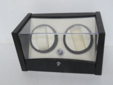 An automatic watch winder, no cable.