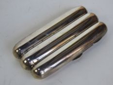 A hallmarked silver cigar case having gilt interior and space for three cigars.