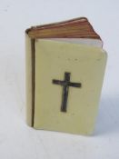A pocket 'Book of Common Prayer' having hallmarked silver crucifix to front.