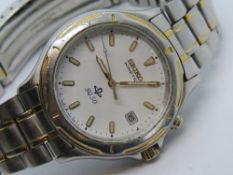 A Seiko Kinetic SQ50 wristwatch, having date aperture, skeleton back and stainless steel strap.