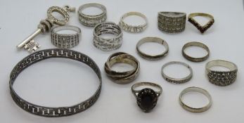 A quantity of rings each stamped silver or 925, together with a bangle and a 925 silver key pendant.