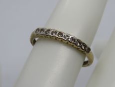 A 9ct gold half eternity ring, hallmarked 375, size R-S, 1.6g.