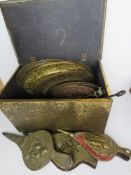 A brass covered log box containing fireplace tongs,