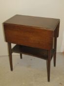 An early 20thC fold-over occasional table having rotating top and measuring approx 75 x 56cm,