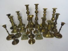 A large quantity of assorted brass candlesticks approx.