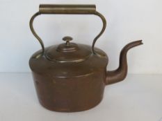 A copper kettle, approx 29cm to spout.