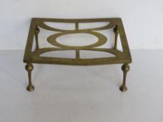 A brass trivet.