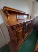 An impressive Gothic Revival carved oak buffet or sideboard, four doors,
