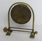 A brass table top dinner gong with mallet, standing 25.5cm high.