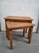 A nest of two pine tables.