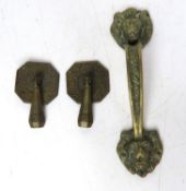 A delightful pair of Arts & Crafts drawer handles together a brass lion's mask pull handle.