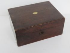 An antique workbox having mother of pearl inset to lid,