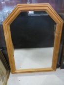 A large pine framed mirror 90 x 63 cm.