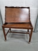 A superb butlers tray trolley, brass corner bracing, pie curst galleried edge to the tray.