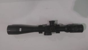 An 8-32x44E-SF hunting rifle scope with mount brackets. This lot will be available to collect in