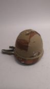 A US M1 helmet with chocolate chip camo cover. This lot will be available to collect in person 48
