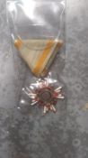 A Japanese Order of the Sacred Treasure medal. This lot will be available to collect in person 48