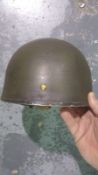 A British Cold War era Paratrooper helmet with liner and chinstrap. This lot will be available to