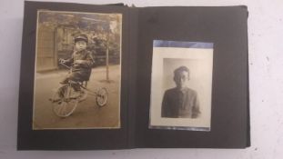 A WWII Japanese Naval Officers photograph album, leather bound with original photos within. This lot